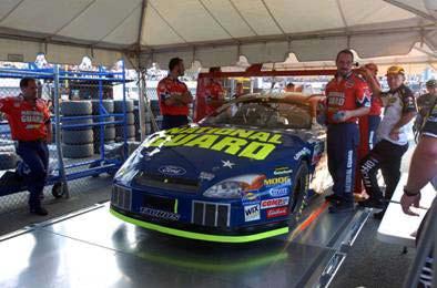 NASCAR S MAINTENANCE OF STANDARDS The team pushes the No. 16 National Guard car through NASCAR s technical inspection.