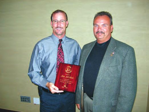 Photo by Joel Jackson. Greg Pheneger received the 2007 FGCSA Distinguished Service Award from current President Craig Weyandt at the Past Presidents Dinner May 10 in Naples. Photo by Joel Jackson.