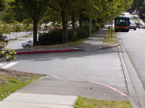 By creating a tighter turn for vehicles, curb extensions also slow turning traffic.