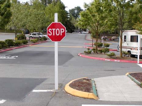 The smaller exit radius makes it possible to place the stop sign closer to the street, improving visibility for the driver as well as helping walkers. S1.