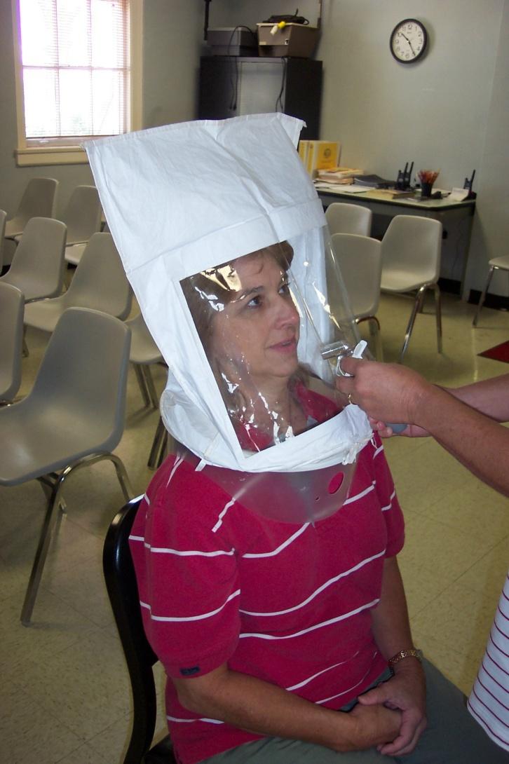 The test hood is placed over the subject s head (without the respirator on) and the sensitivity