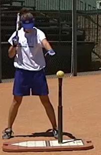DRILL #3 ONE ARM DRILL 11 Designed to help players who pull out with their front shoulder. Player takes normal stance beside a tee that is set up in front of a net. 1. Player holds youth-size bat in back hand while holding front hand over the ball that is on the tee.