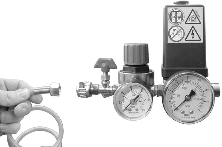 (- & + arrows are shown on the knob) If the compressor has not been used recently, open the drain valve shown to drain any condensate which may have accumulated.