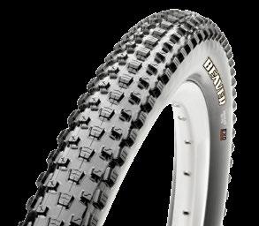 The dual-compound tread uses a hard base layer to reduce rolling resistance and provide knob support, while the siped, softer outer