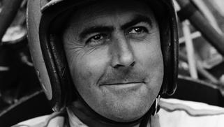 He won two World Championships with the Cooper Car Company, after developing the firm s rear-engined racing machines.