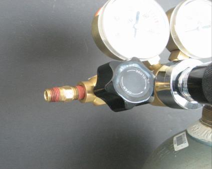 Attach one end to the gas regulator using the