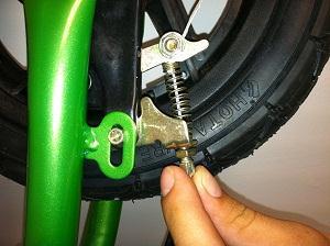 should spin freely but stop when lever is squeezed. When the bike is new there is a break-in period, wait until the bike has been used for a couple of hours then try to adjust it again.