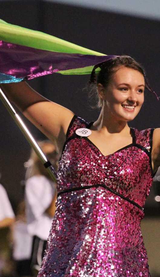 Junior Amy Ellis performs with the flag team this fall.