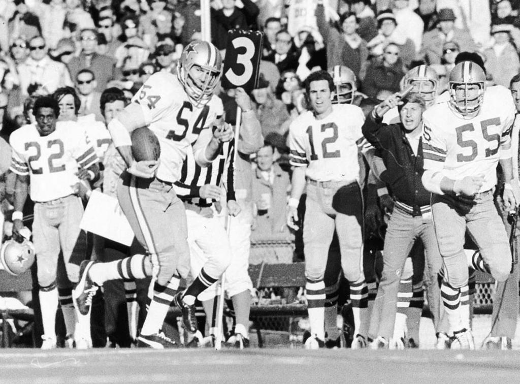 Chuck Howley intercepts a Bob Griese pass during the Cowboys first Super Bowl victory in January. Dallas beat the Miami Dolphins 2 3. Cowboy quarterback Roger Staubach () stands on the sidelines.