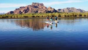 Standup Paddleboarding This activity is performed on a gentle section of the desert river where the current is slow and the water is deep.