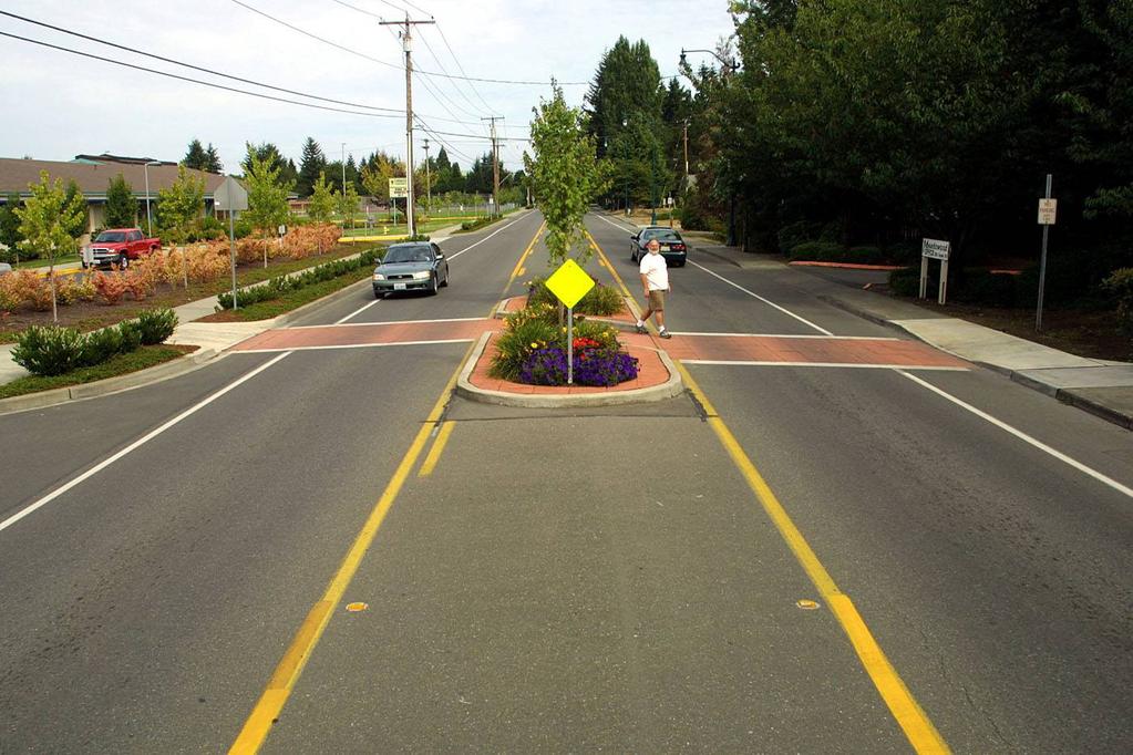 mid-block crossings where needed Re-design intersection at E Ford St and OK-66 E to introduce a traffic signal and