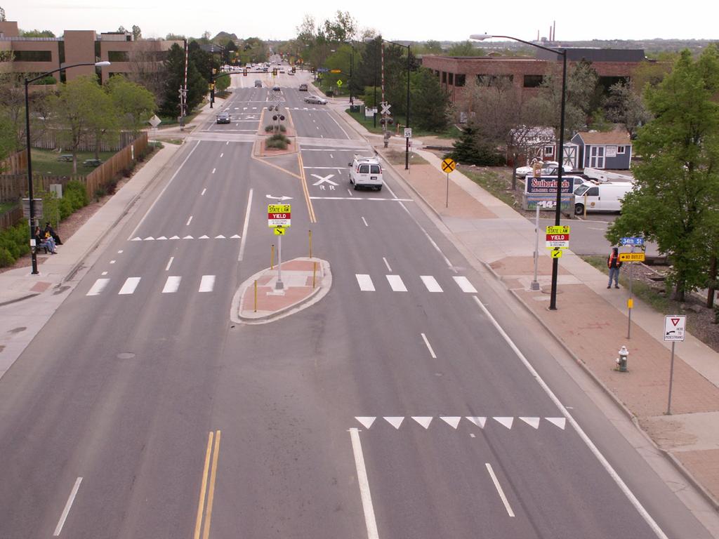 crossings to provide access along E Pine St, across OK-66 to provide additional pedestrian and bicycle connectivity