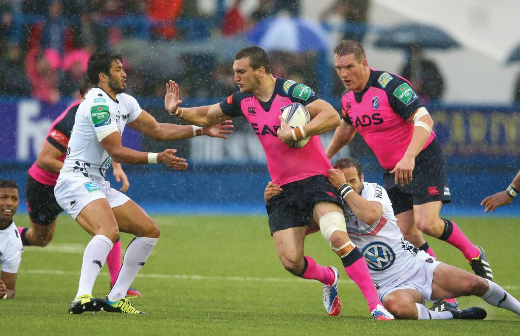 Image: Warburton being tackled by Frederic Michalak and Maxime Mermoz during the Heineken Cup match between Cardiff Blues and Toulon in Wales, 2013.