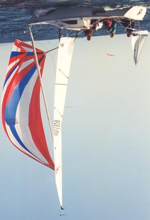Downwind: For running conditions, the general rule of thumb is to fly the pole at a height that keeps the spinnakers at an even height off the water as shown in this photo.
