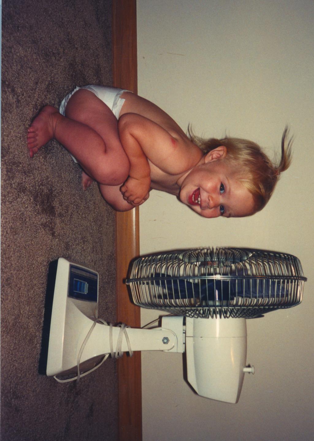 Number One Fan A young Emily (Emma) Spencer cools herself down in front of a high-powered fan. One day I just decided to play with the fan.