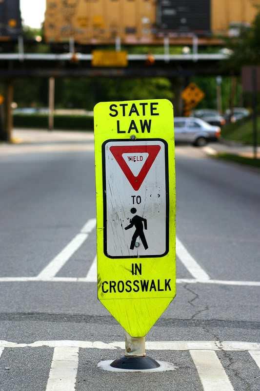 (1) In-street Pedestrian Crossing sign is allowed per crosswalk location; The sign should be placed at the roadway centerline adjacent to the crosswalk, not in the crosswalk ; If a center island is
