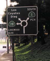 The sign should be either a destination sign using text (D1-3) or using diagrams. Examples of both are shown in Exhibit 7-13.