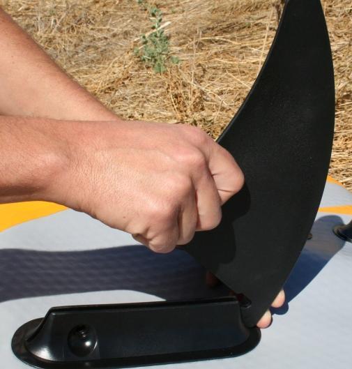 For the center Deep Fin, start by sliding the front hook of the Fin into place on the Fin holder and then slide the Deep Fin into place and