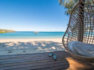 Relax out on the deck overlooking colourful coral reefs or take a stroll around the island and enjoy