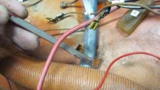806. Pry open the wire clip to the main wiring