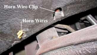 810. Slip the horn wires off the wire clip
