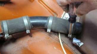 Remove the gas tank filler tubes and tank as
