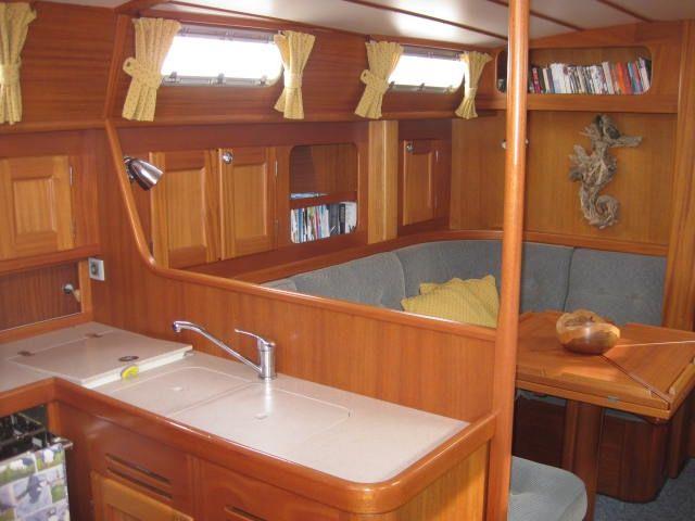 berths port and starboard Clock and barometer Forward owners cabin Large double bed with drawers under Bedding mattress above main mattress Storage in cupboards and wardrobes Large opening hatch