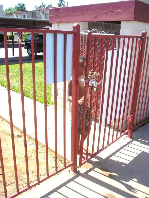 1. Self-Latching Gate/Door Unsupervised child going through unlatched gate photo