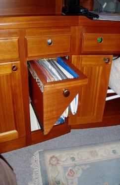 Saloon Outboard facing, large chart table with large chart drawer Swing-out navigator's seat, sideboard and drinks cabinet to starboard Switch panel with circuit breakers and gauges at chart table