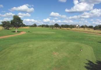 With two large fairway bunkers on the left, and water on the right side of the fairway and green,