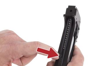 Pull down on the follower until you are able to slide it into the retention slot on the left side