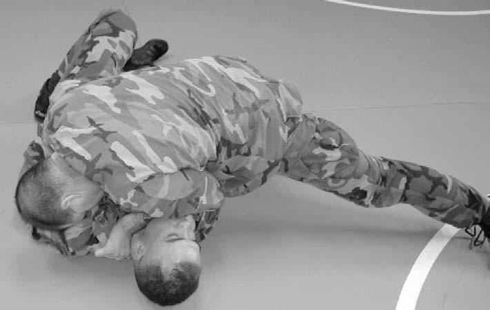 Figure 4-74. Choke from the knee mount with hand on far side of enemy s neck, step 1. (b) Step 2 (Figure 4-75).