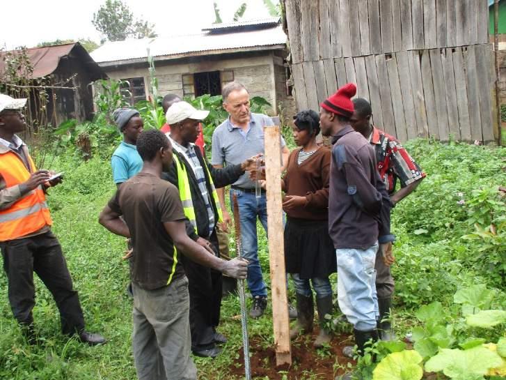 Figure 10: Across Africa team with Jon Hongve of AfCAP training a local on how to read and record daily rainfall amounts (Trial Section E511) 2.3.