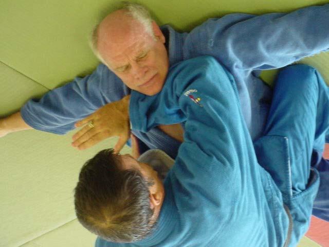 Here we do a forearm choke against the front