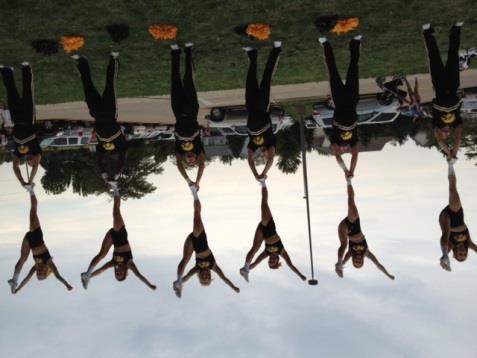The proud tradition of the Iowa Spirit Squad is carried on by over 50 dedicated student-athletes who devote15-20 hours every week to practices, games, special appearances, camps and competitions.