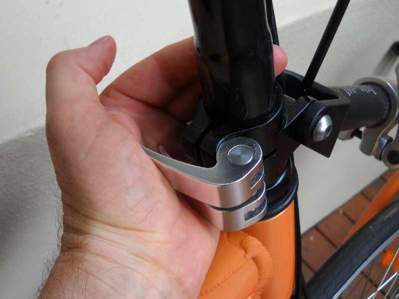 Slide the steering column (in the small parts box) into the pivot clamp and over the fork steerer tube with the clamping slot