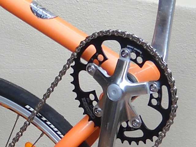 36. Turn the pedals and adjust the rear derailleur cable barrel adjuster until the chain runs quietly without clicking or grinding.