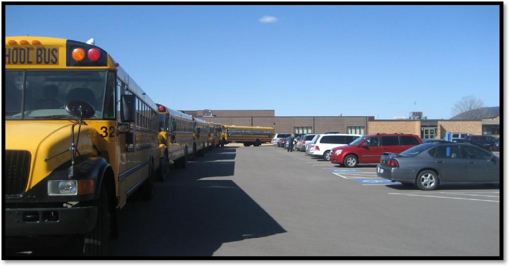 Existing Issues and Challenges School parking lot at Rosemount Elementary during afternoon dismissal.