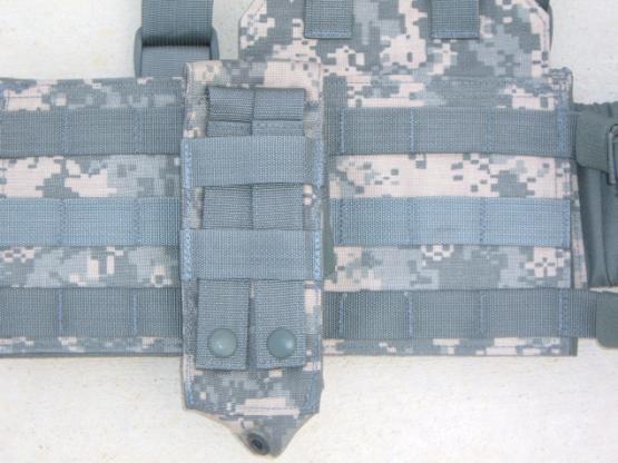 This picture shows an M4 Double Mag Pouch lying on the harness where it is to be mounted. You are looking at the backside of the pouch.