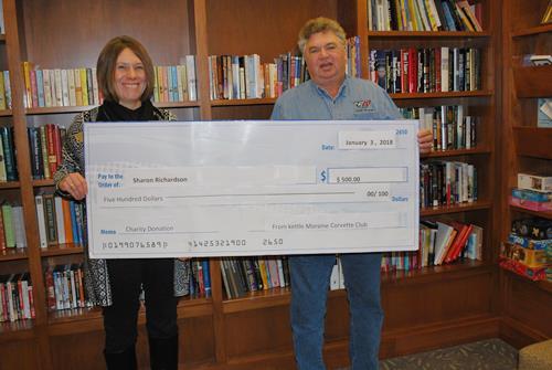 ONE MORE DONATION KMCC s Rick Waldbauer presenting a check to