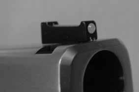 of the filament by positioning it close to the flame until a bulb forms the same size as the pocket in the serrated face of the front sight.