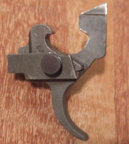 A projection on the semi-auto trigger arm acts on the bottom of the sear pulling it foreward, which in turn pulls the rear of the sear
