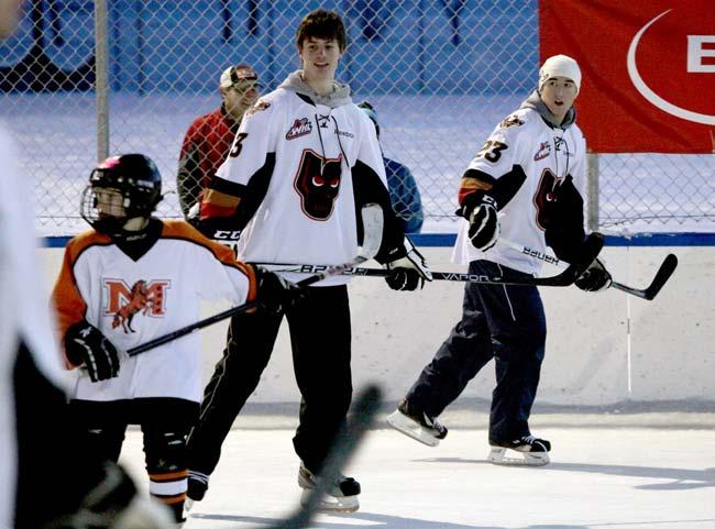 community > The Hitmen love taking the time to practice with minor hockey players, giving