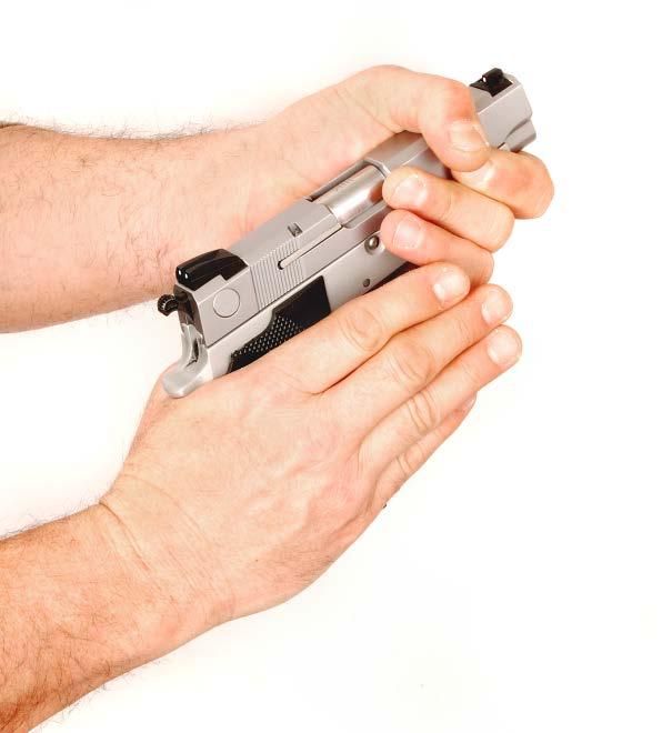 THUMB AND FOREFINGER OF SHOOTING HAND IS PLACED