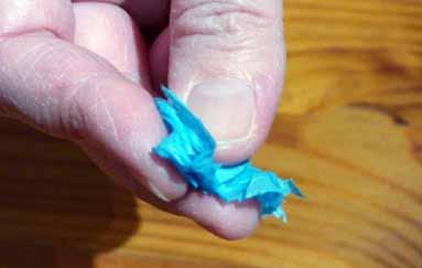 Tissue paper Encourage tearing of tissue paper and scrunch pieces of paper into small balls by rolling with finger tips.