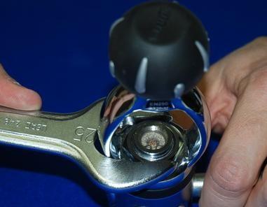 TO PREVENT THE YOKE RETAINER NUT FROM WORKING LOOSE ACCIDENTALLY, POUR ONE OR TWO DROPS OF