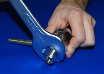 DISASSEMBLY Using a 32-mm open end wrench (B16), unscrew