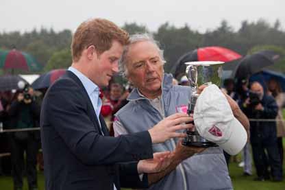 Right, HRH Prince Harry helps Rhett Wooldridge,