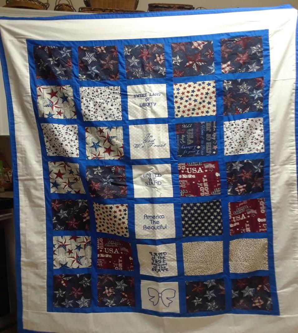 Raffle tickets for this quilt are $10.00/ea. The quilt with the 6 blocks, some embroidered, with the white border measures 59 X 45. Raffle tickets for this quilt are $5.00/ea. The quilt with the 12 flag blocks with the red border measures 59 X 52.