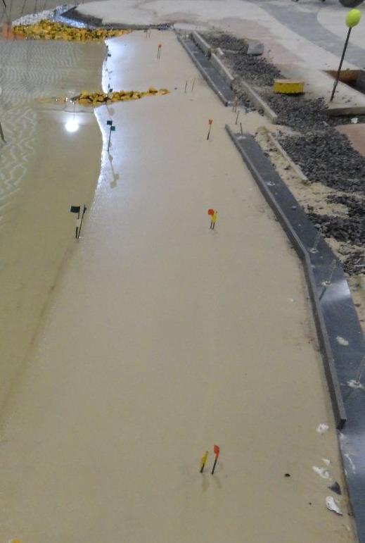 favourable results for the reduction of splash on the walkway in this region. However, this solution was not effective enough to entirely eliminate severe splash under operational conditions.